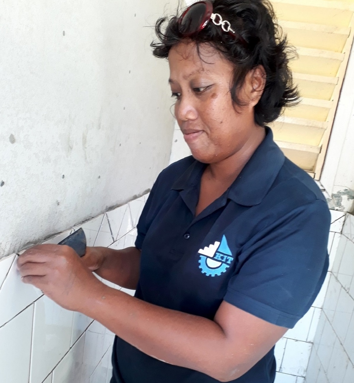 New beginning for i-Kiribati female tiling trainer